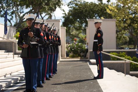 A Marine Corps Honor Guard Holds Its Rifles At Port Arms Before A