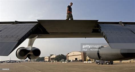 Air Force Mechanic Inspects The Wings Of A B 52H Long Range Strategic