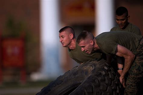 Aspiring Marines Lifting Tire During Physical Fitness Test