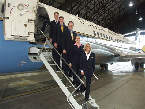 C 9C Flight Attendants Stand Ready