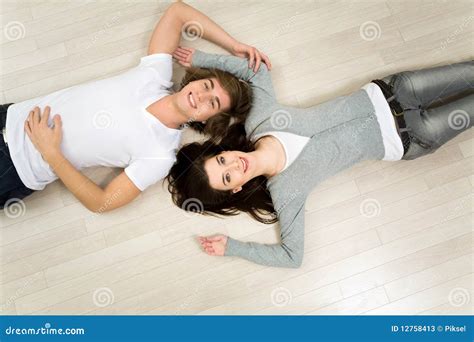 Couple Lying On The Floor Stock Image Image Of Interior 12758413