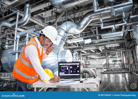 Electrical Engineer Working At Control Room Of Powerhouse Stock Image