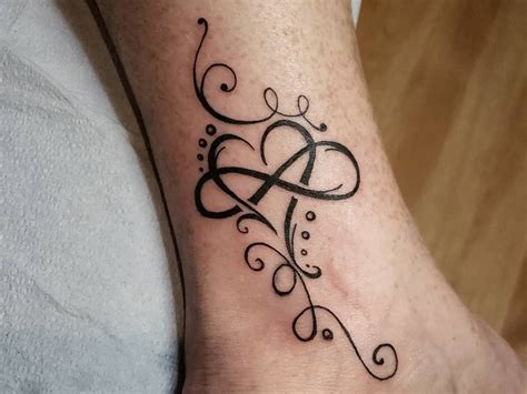 Infinity Sign With Hearts Tattoo