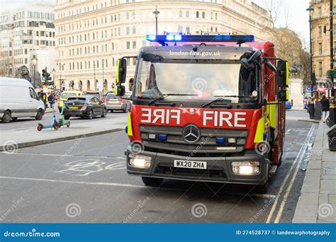 London Fire Brigade Vehicle In Central London With Blue Lights