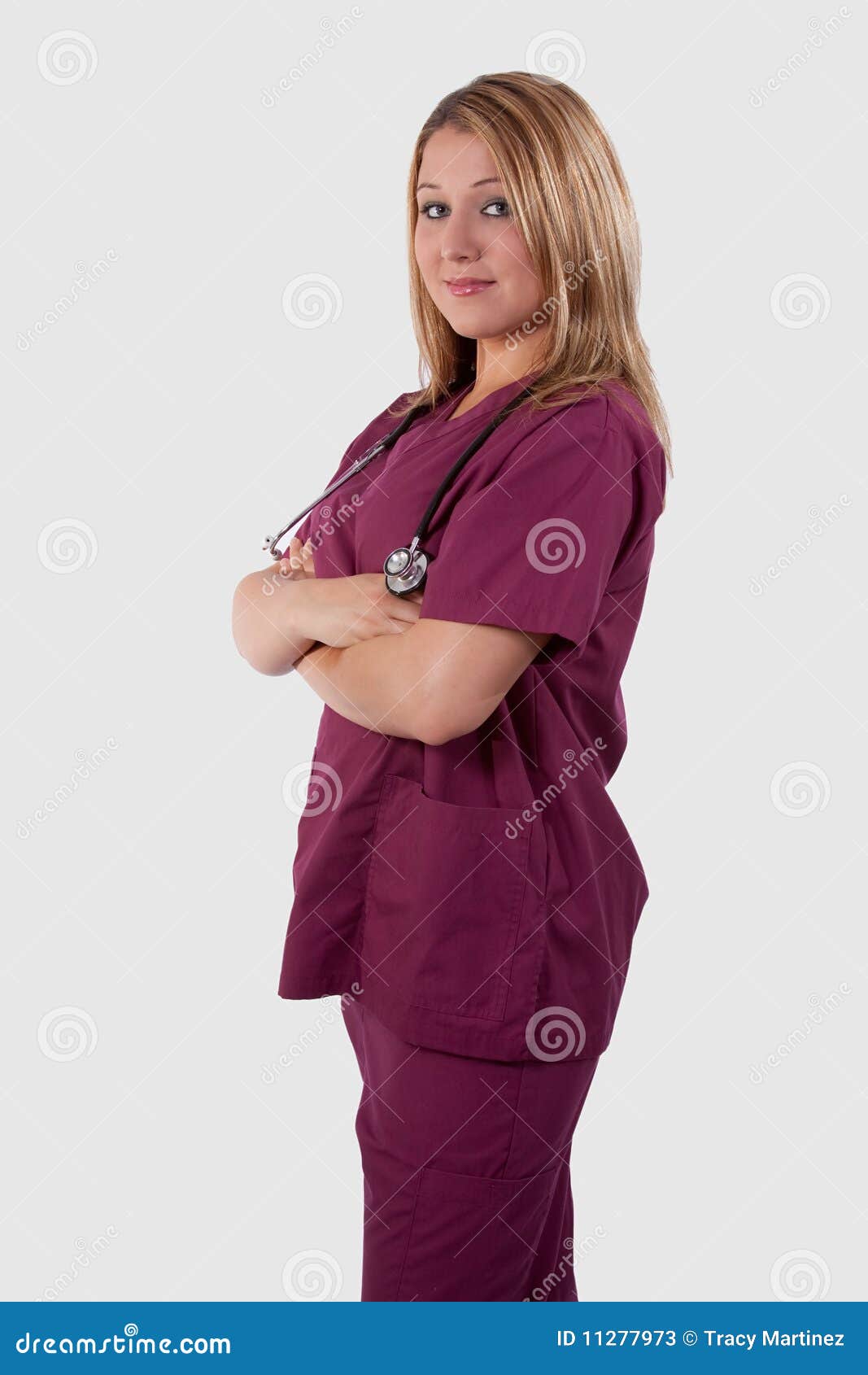 Nurse Standing In Maroon Scrubs Jpg Von Voigtlander Women S Hospital