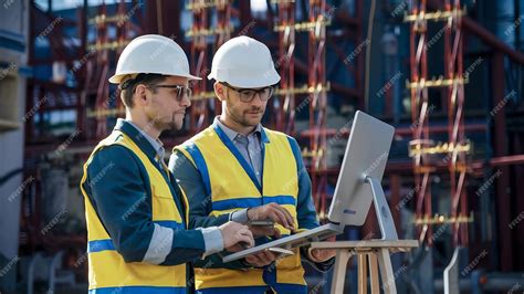 Premium Photo Picture Of Two Electrical Engineers Checking Electrical