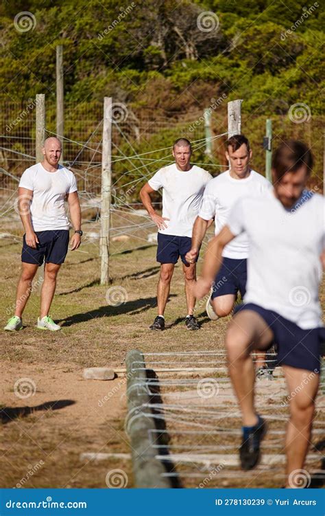 Unless You Puke Faint Or Die Keep Going A Group Of Men Doing Drills