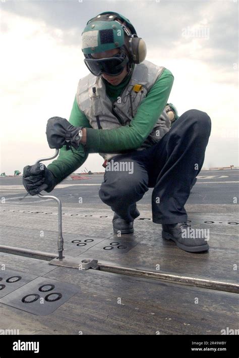 Us Navy Airman Tightens Catapult Track Buttons On One Of Four Steam